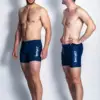 Two men wearing aqua
