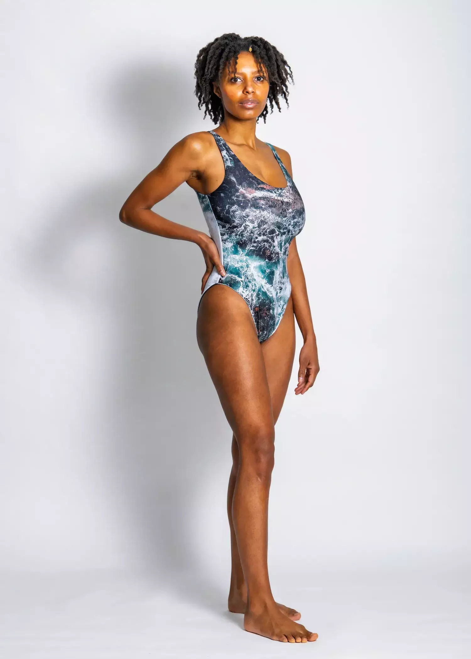 A woman wearing the green pacific waves