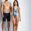 A man and a woman wearing green pacific waves