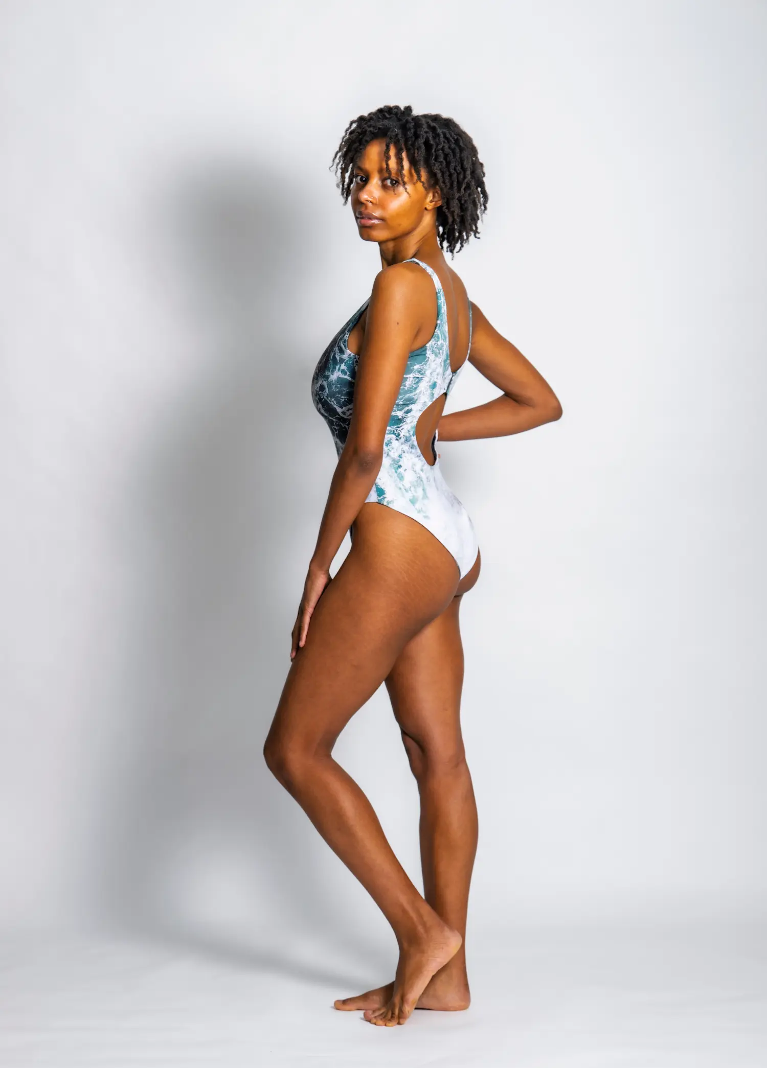 A woman wearing the green pacific waves